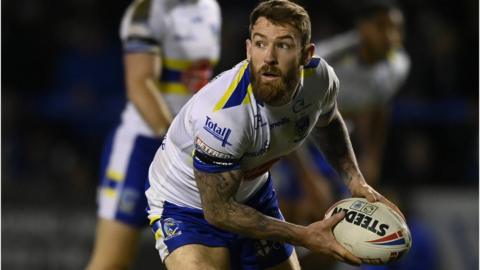 Daryl Clark of Warrington passing a rugby ball