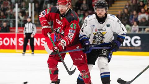Cedric Lacroix of Cardiff Devils and Dennis Busby of Manchester Storm 