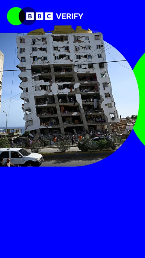 Destroyed building in Verify branding