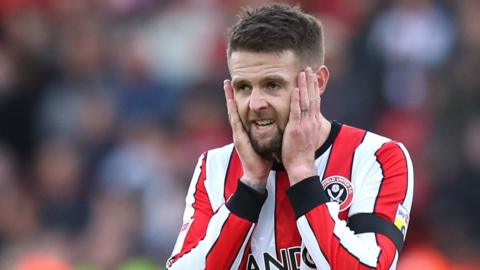 Oliver Norwood looks shocked