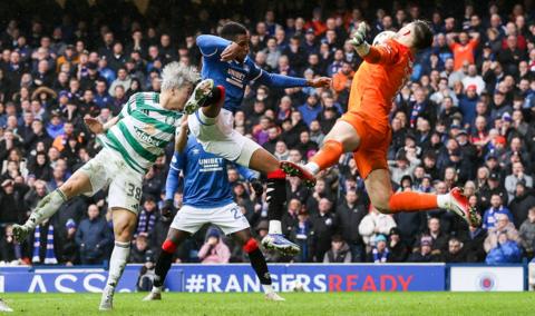 Celtic's Daizen Maeda headers the ball off Rangers defender Dujon Sterling's arm