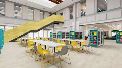 A CGI image of how the courtyard in the new library will look. It shows a study area with a space for about 30 people, bookshelves and a covered stair area up to the first floor.