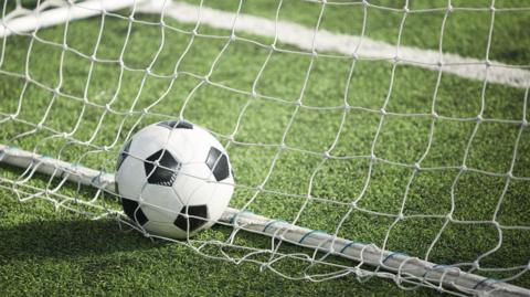 Generic image of a football in the back of a net