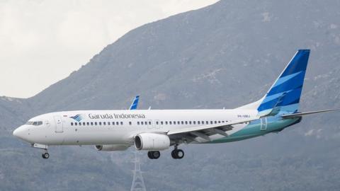 A Boeing 737-8U3 passenger plane belonging to the Garuda Indonesia lands at Hong Kong International Airport in 2018