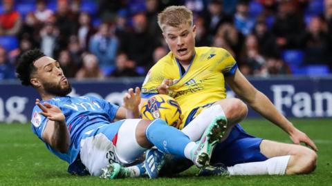 Kyle Wootton forces home Stockport's first goal against Colchester