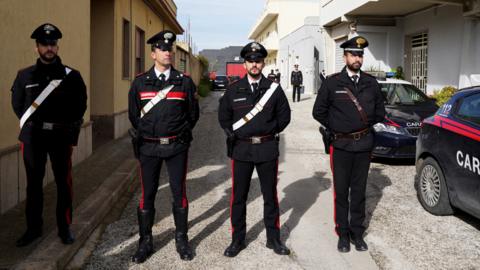 Italian police stand guard outside Matteo Messina Denaro's hideout