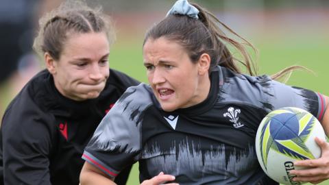Jasmine Joyce chases Kayleigh Powell in Wales World Cup training
