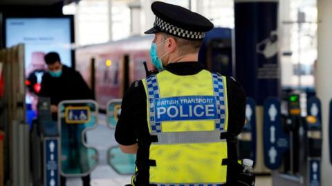 Picture of a police officer at a station