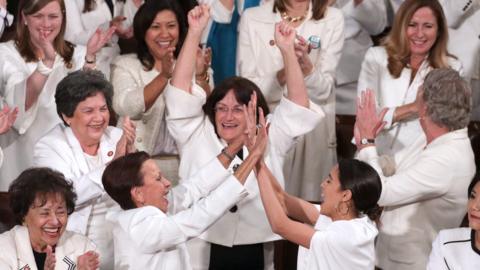 Democratic women cheer during Trump's State of the Union speech