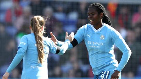 Manchester City's Khadija Shaw celebrates scoring against Liverpool in the WSL