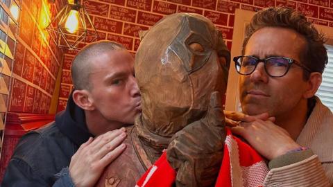 Channing Tatum and Ryan Reynolds at The Turf pub in Wrexham with a Deadpool sculpture