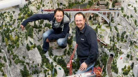 The creator twin brothers Frederick (L) and Gerrit Braun of the "Miniatur Wunderland" are pictured in the train set on April 2, 2009 in Hamburg, Germany.