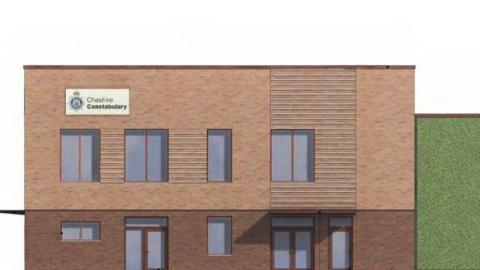 An artist render of the new police base. It is a brick building with windows and glass doors. There is a sign on the top left hand side of the building which the Cheshire Constabulary logo on it.