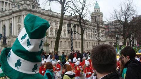 People line the streets in celebration of St Patrick's Day.