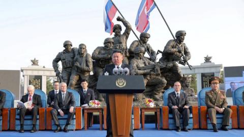Kim Jong Un speaks during the opening ceremony of a memorial for North Korean troops killed while fighting for Russia in the war against Ukraine