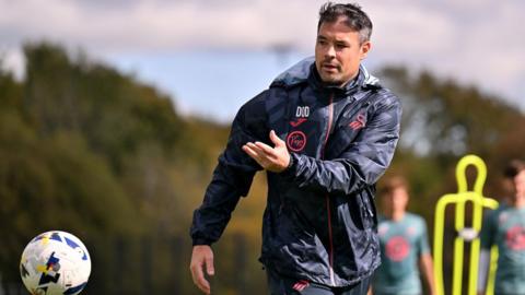 Darren O'Dea throws a ball during Swansea training 