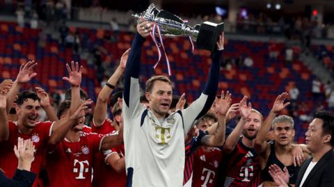 Manuel Neuer with a trophy after Bayern Munich beat Aston Villa in friendly