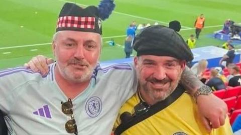 Robert McCahill (left) withhis brother Stephen at a Scotland match