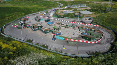 Aerial view of Hempsted Household Recycling Centre, which is arranged in an oval shape with the containers in the middle.