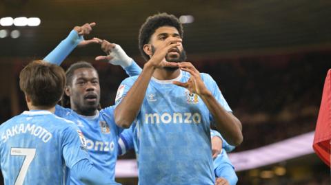 Ellis Simms celebrates after scoring one of his two goals for Coventry