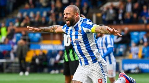 Kyle Vassell celebrates