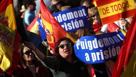 Pro-unity demonstrators with banners calling for the imprisonment of sacked Catalan President Carles Puigdemont, gather in Madrid, Spain, October 28, 2017