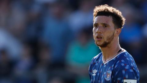 Jordan Gibson in action for Carlisle