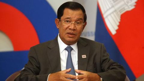 Hun Sen speaking at a conference