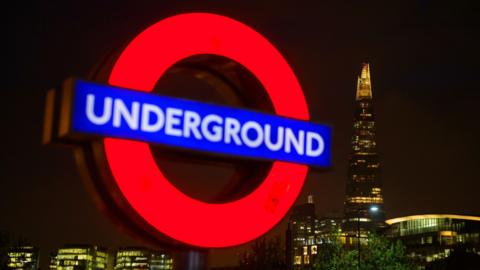 Underground sign at night