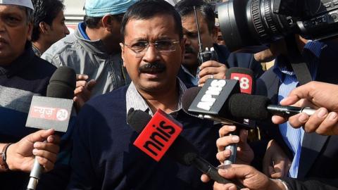 Delhi chief minister Arvind Kejriwal arrives at a polling station in New Delhi on February 7, 2015.