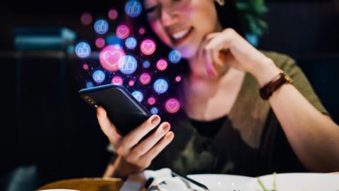 Woman looks at phone