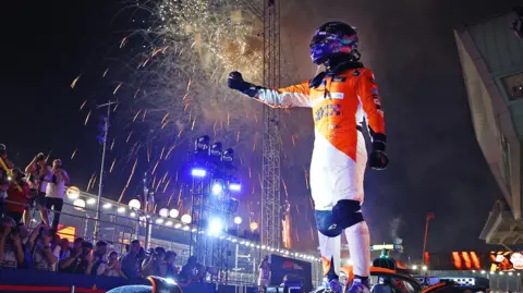 Lando Norris celebrates winning the Singapore Grand Prix