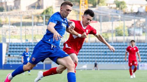 Penybont’s Nathan Wood in action against Sant Coloma