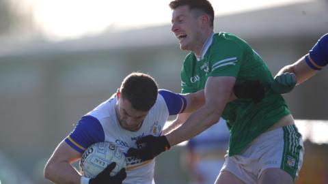 Cargin's Kevin McShane challenges Errigal Ciaran's Niall Kelly at Corrigan Park