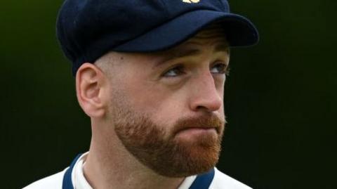 David Lloyd looks on while playing for Derbyshire