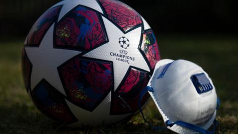 Champions League ball and face mask