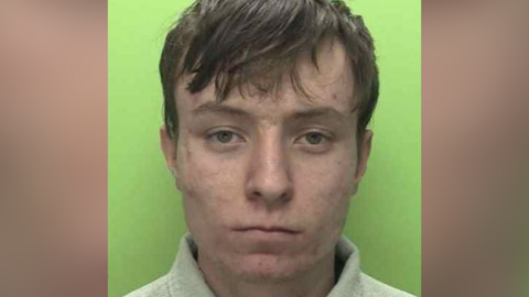 Custody photo of Matthew Ward with short brown hair