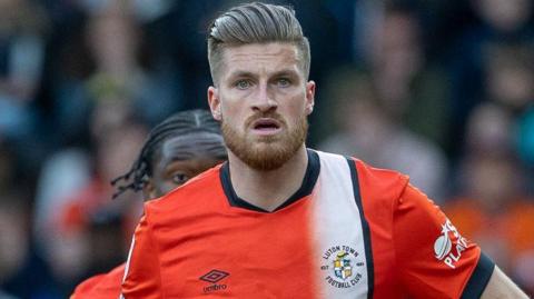 Reece Burke in action for Luton