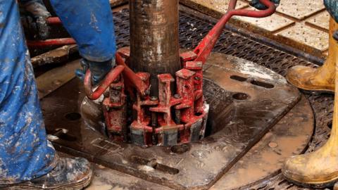 Engineers at work on the drilling platform of the Cuadrilla shale fracking facility on October 7, 2012 in Preston, Lancashire.