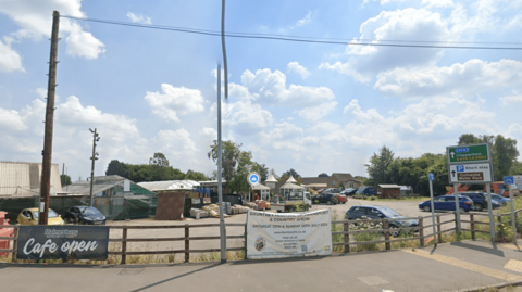 The Garden Centre site in Malmesbury which includes a car park and a number of commercial buildings.