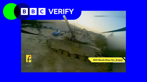 A screenshot from a video feed of an FPV drone, it is approaching a tank 