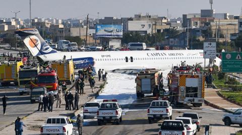 The aircraft stands on a road after leaving the runway at Mahshahr airport