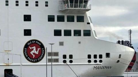 The front of the Manxman ferry, which is white and has the Steam Packet logo on the side.