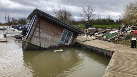 Toppled houseboat