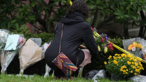 Flowers laid at the site of the mass shooting in a synagogue in Pittsburgh, on 28 October 2018