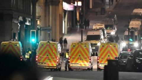 Police vans near College Green