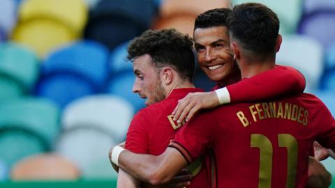 Cristiano Ronaldo (centre) celebrates his goal with Bruno Fernandes