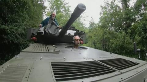 Ben Kaye and his father in the restored tank