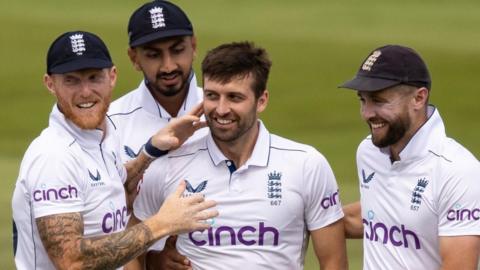 Mark Wood and England celebrate a wicket