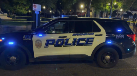 A police car at the scene of Saturday night's shooting in Birmingham, Alabama